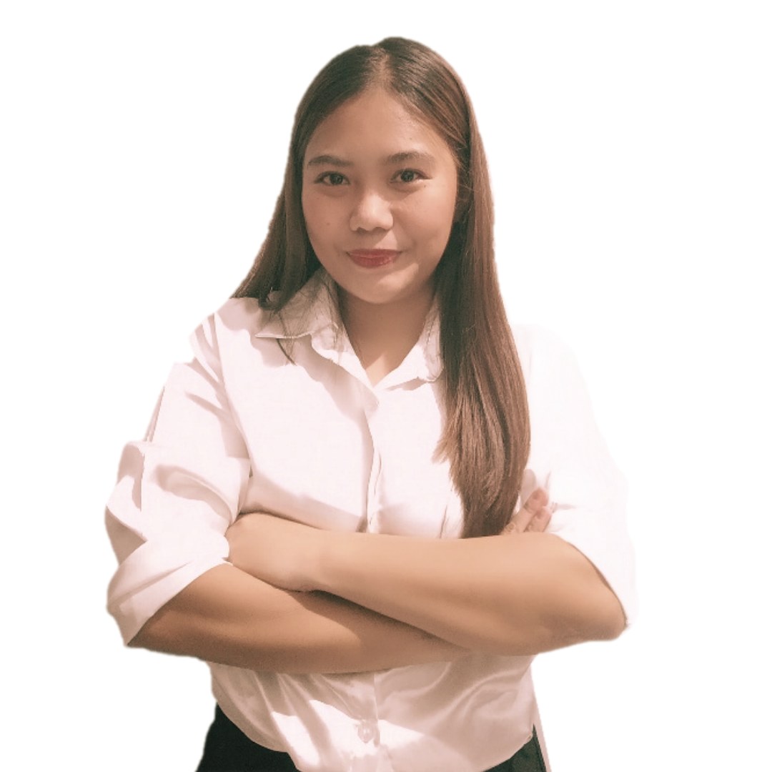 A person with long brown hair, wearing a white button-down shirt, stands with arms crossed against a plain white background.