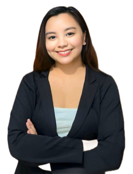 Smiling woman in a black blazer with arms crossed against a beige background