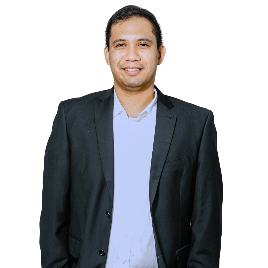 Man in a black suit and white shirt, smiling, against a white background.