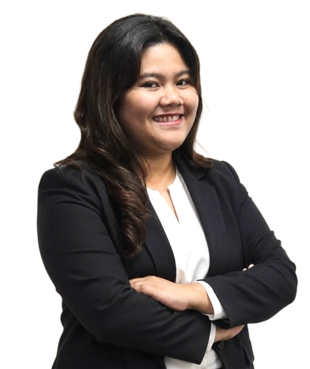 Smiling professional in a black blazer with arms crossed against a neutral beige background
