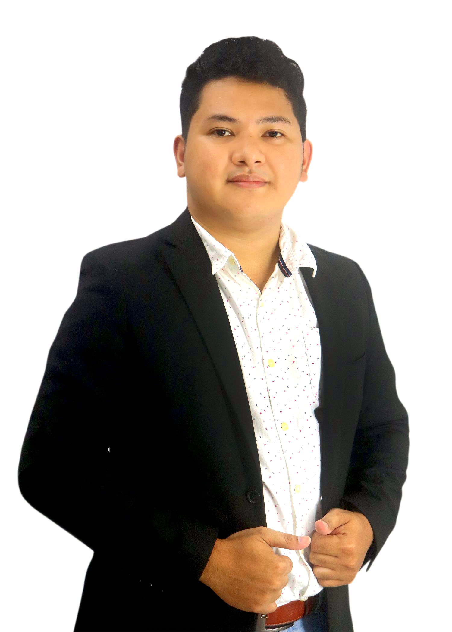 A person wearing a dark blazer over a white patterned button-down shirt, posing against a plain white background.