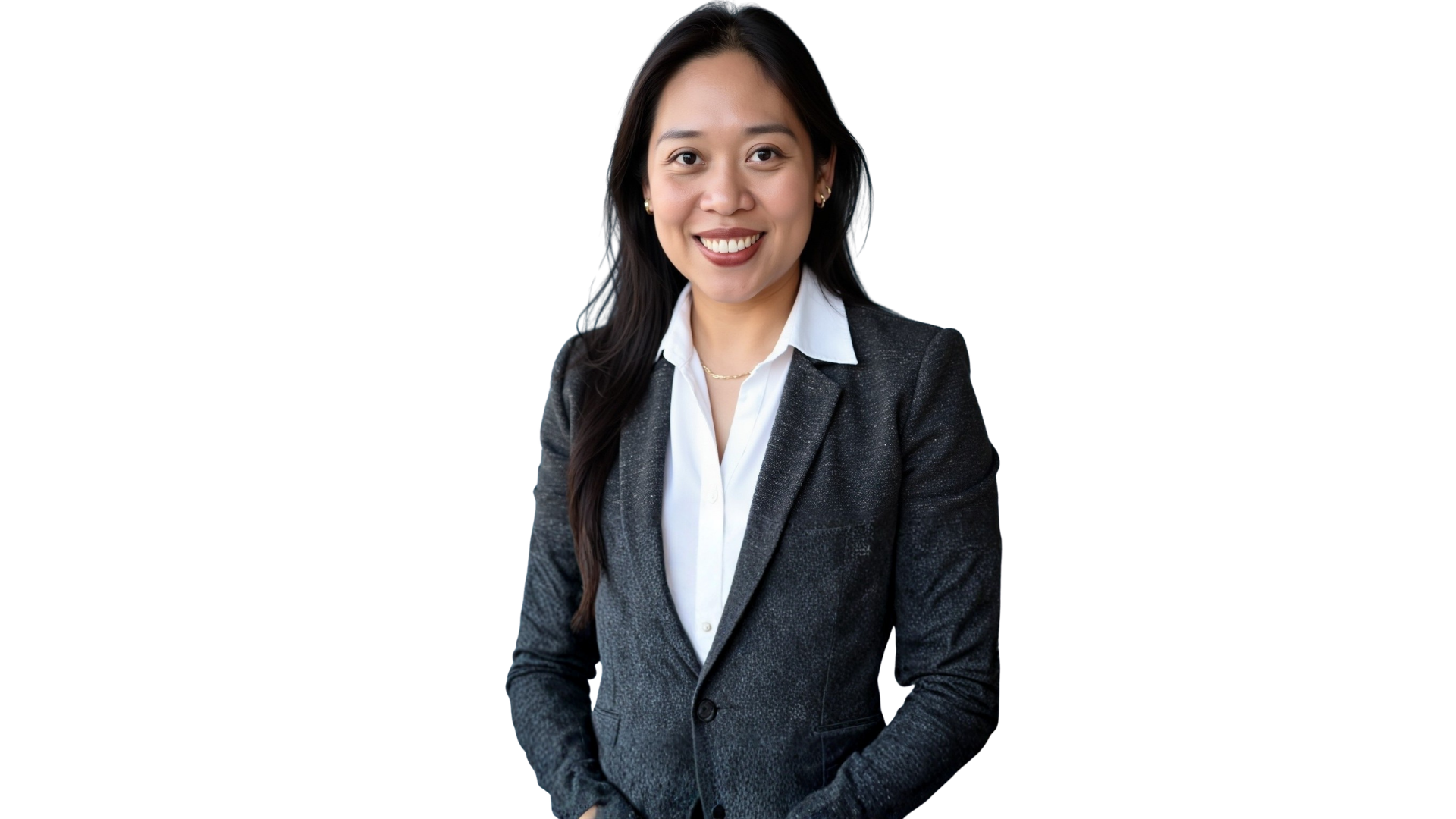 Woman smiling, wearing a gray blazer and white shirt, against a white background.