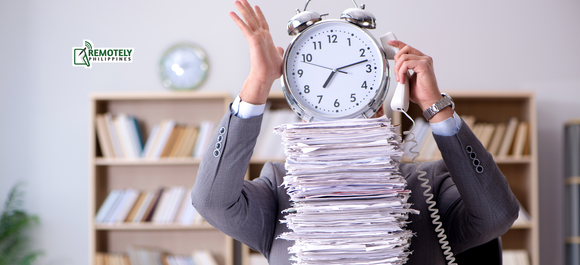 Person buried in paperwork holds a large clock in an office, conveying time pressure