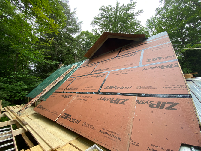 A roof is being built by JG Services with a lot of ZIP sheathing boards on it