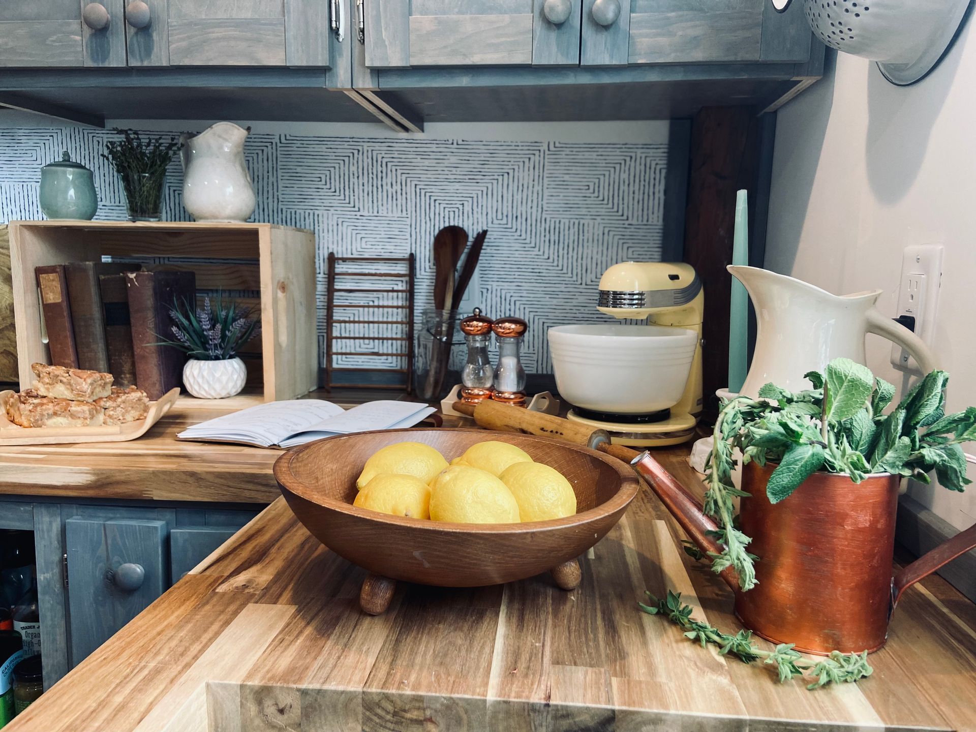 Kitchen redesign showing a closeup of a bowl of lemons on a butcher block countertop in completed by JG Services
