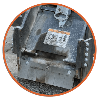 Close-up of a dark grey industrial machine, with a 