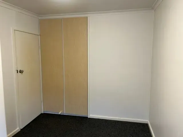 There is a door in the corner of the room.