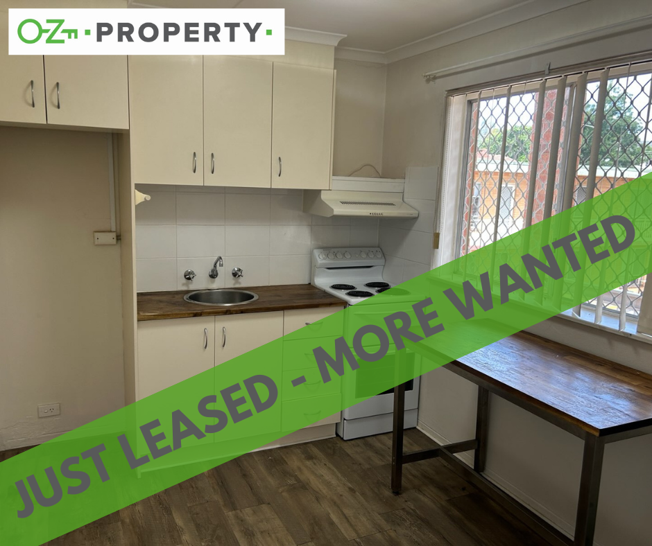 A kitchen with a sign that says just leased - more wanted
