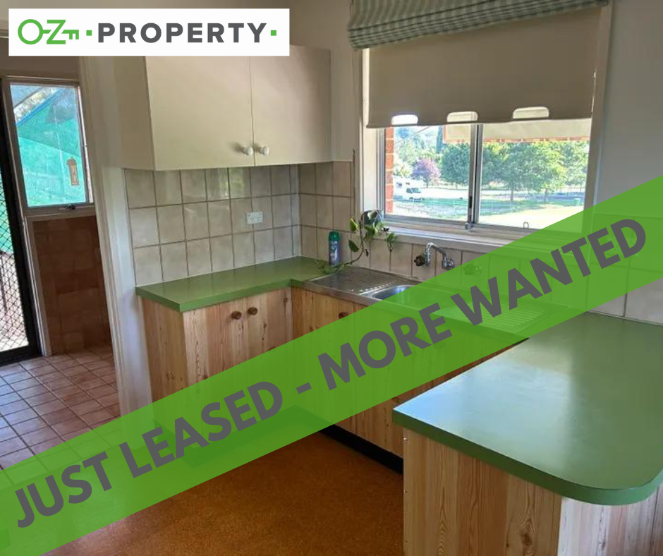 A kitchen with a sign that says just leased - more wanted