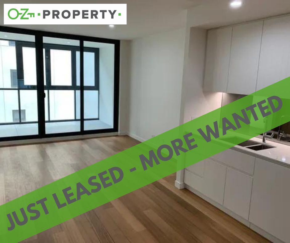 A room with a green banner that says just leased more wanted