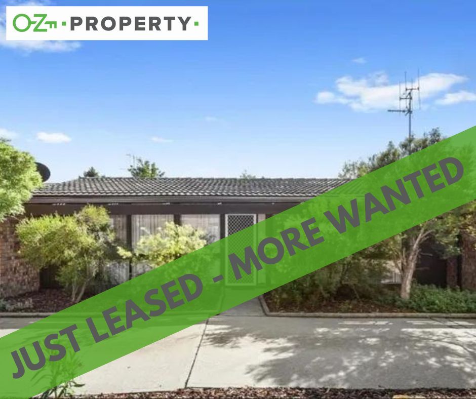 A house with a green banner that says `` just leased - more wanted ''
