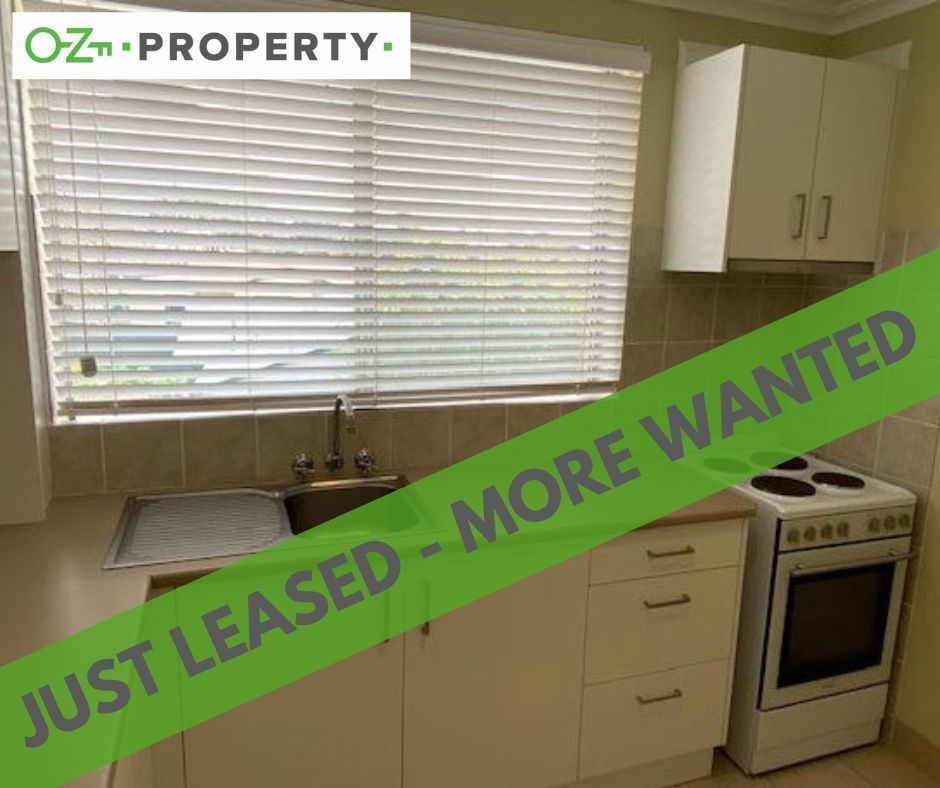 A kitchen with a sign that says just leased - more wanted