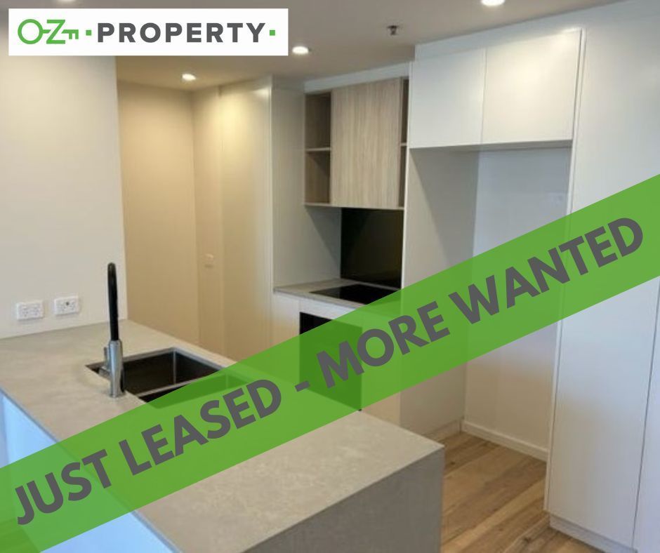 A kitchen with a sign that says just leased more wanted