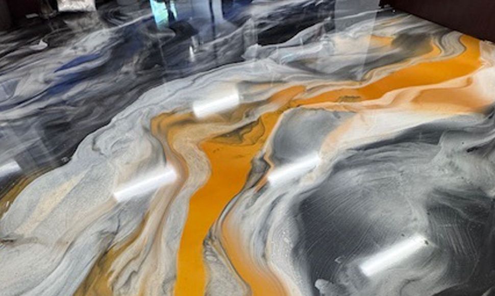 Abstract marbled pattern with flowing gray, white, and orange swirls