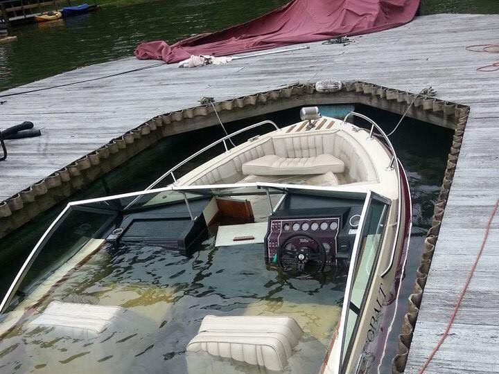 A boat is docked at a dock in the water