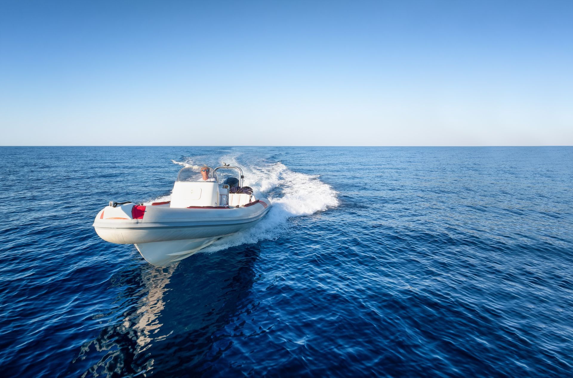 A white boat needs boat repair.