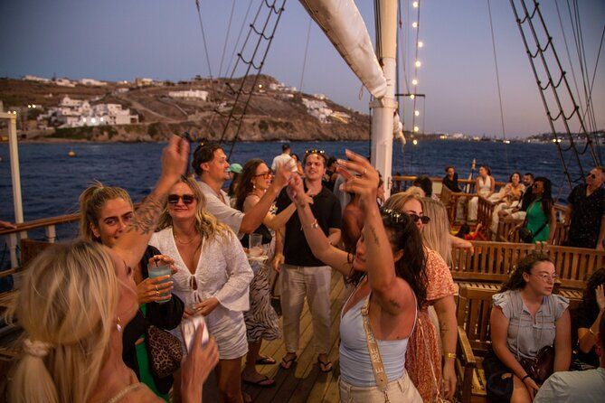 Boat party at sunset near Little Venice, Mykonos