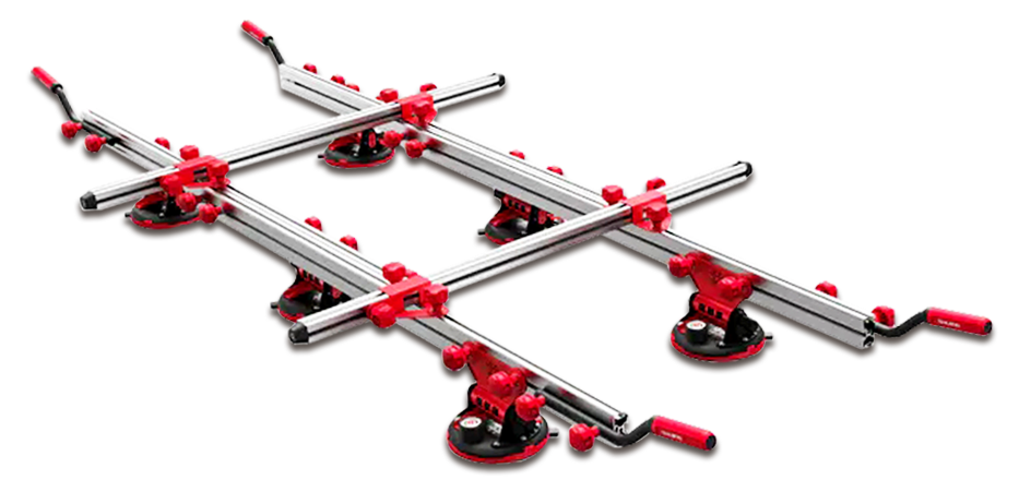 A metal suction-cup lifting frame for large tiles or stone slabs with red handles and adjustable cross-rails.