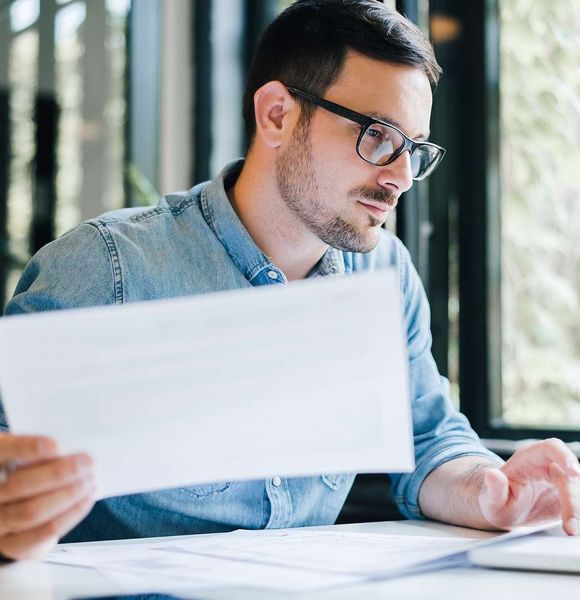 man working with his taxes