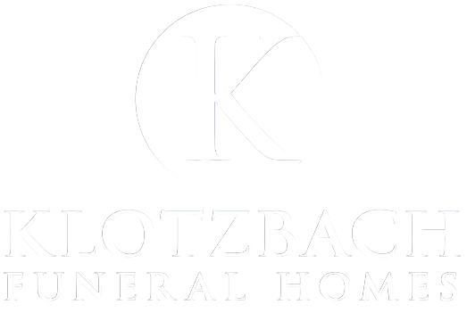 Klotzback funeral home logo in white text