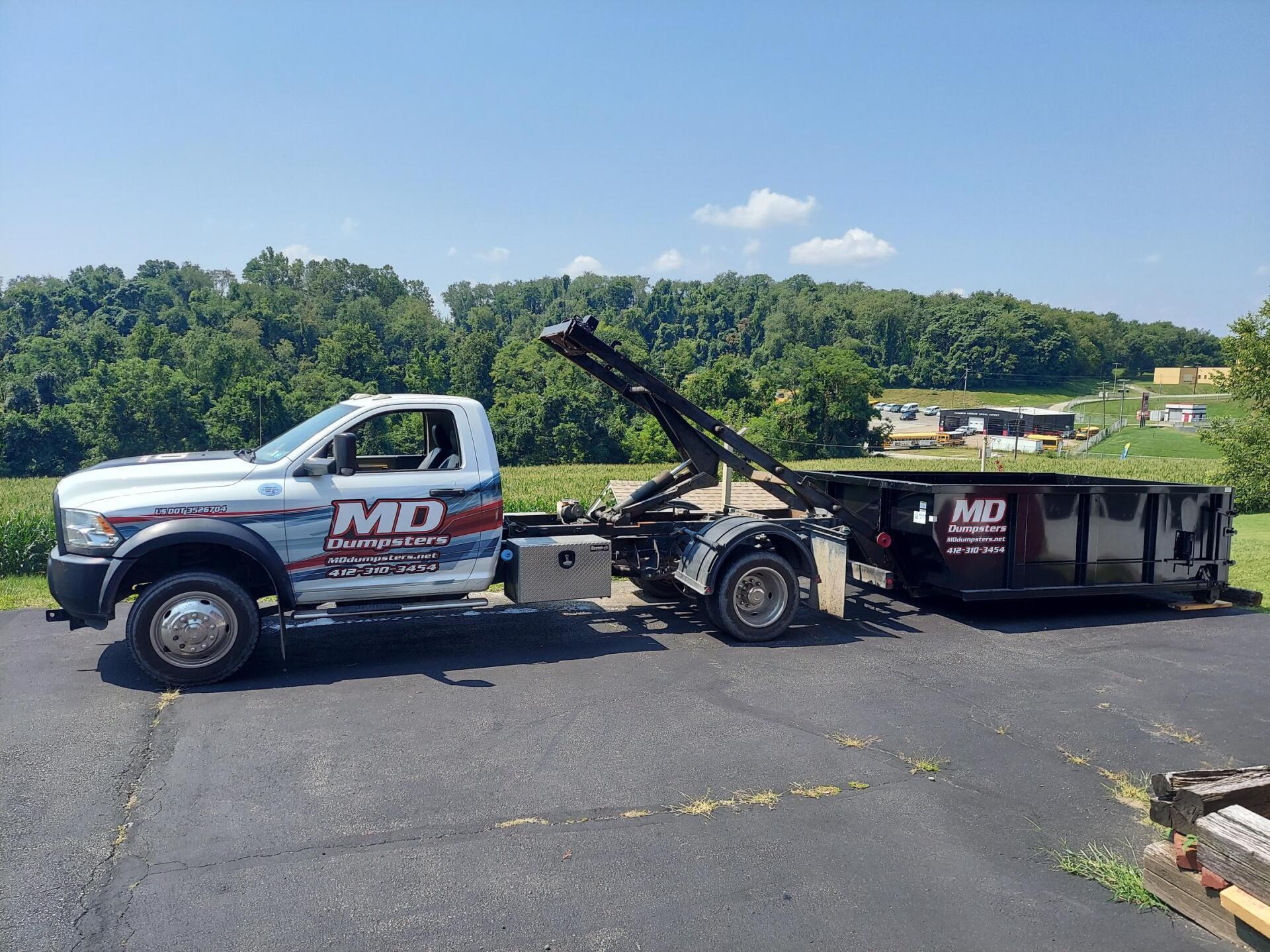 A truck that just delivered a dumpster for dumpster service rentals in South Park, PA