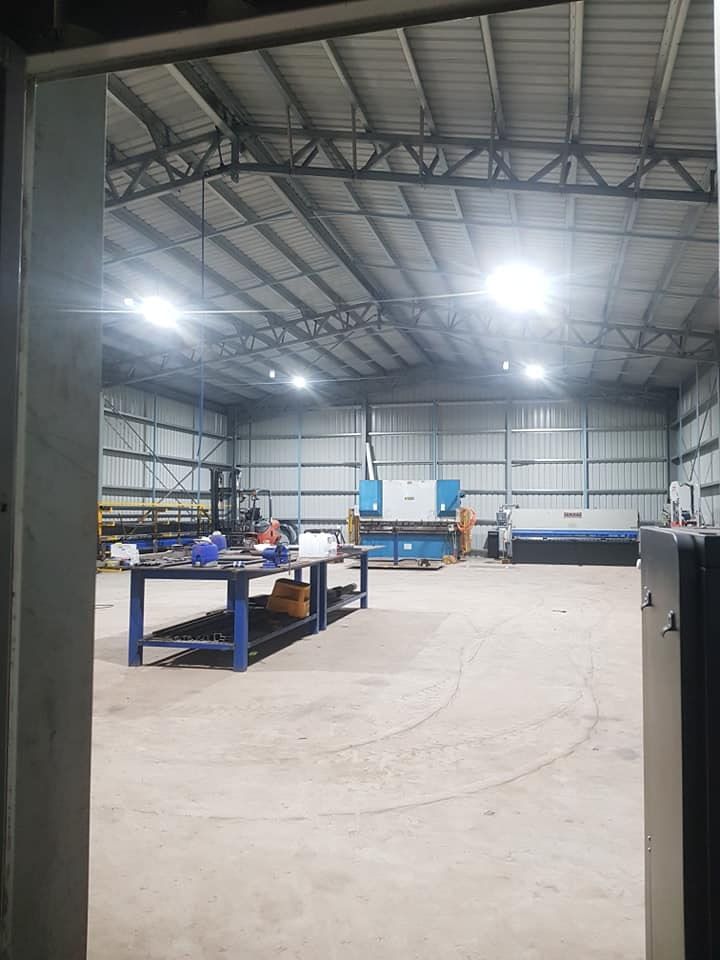 A Large Warehouse With A Lot Of Machinery In It — Prowire Services In Mackay, QLD