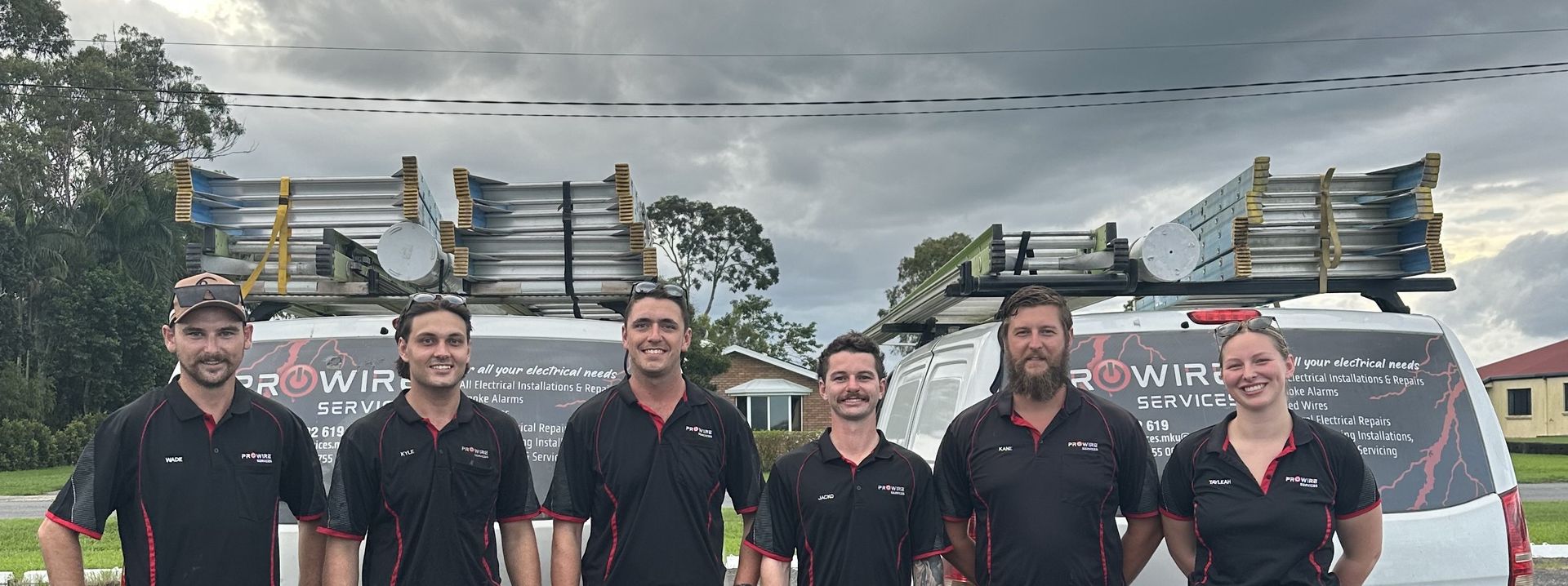 Two MenWorking With A Fuse Box — Prowire Services In Mackay, QLD