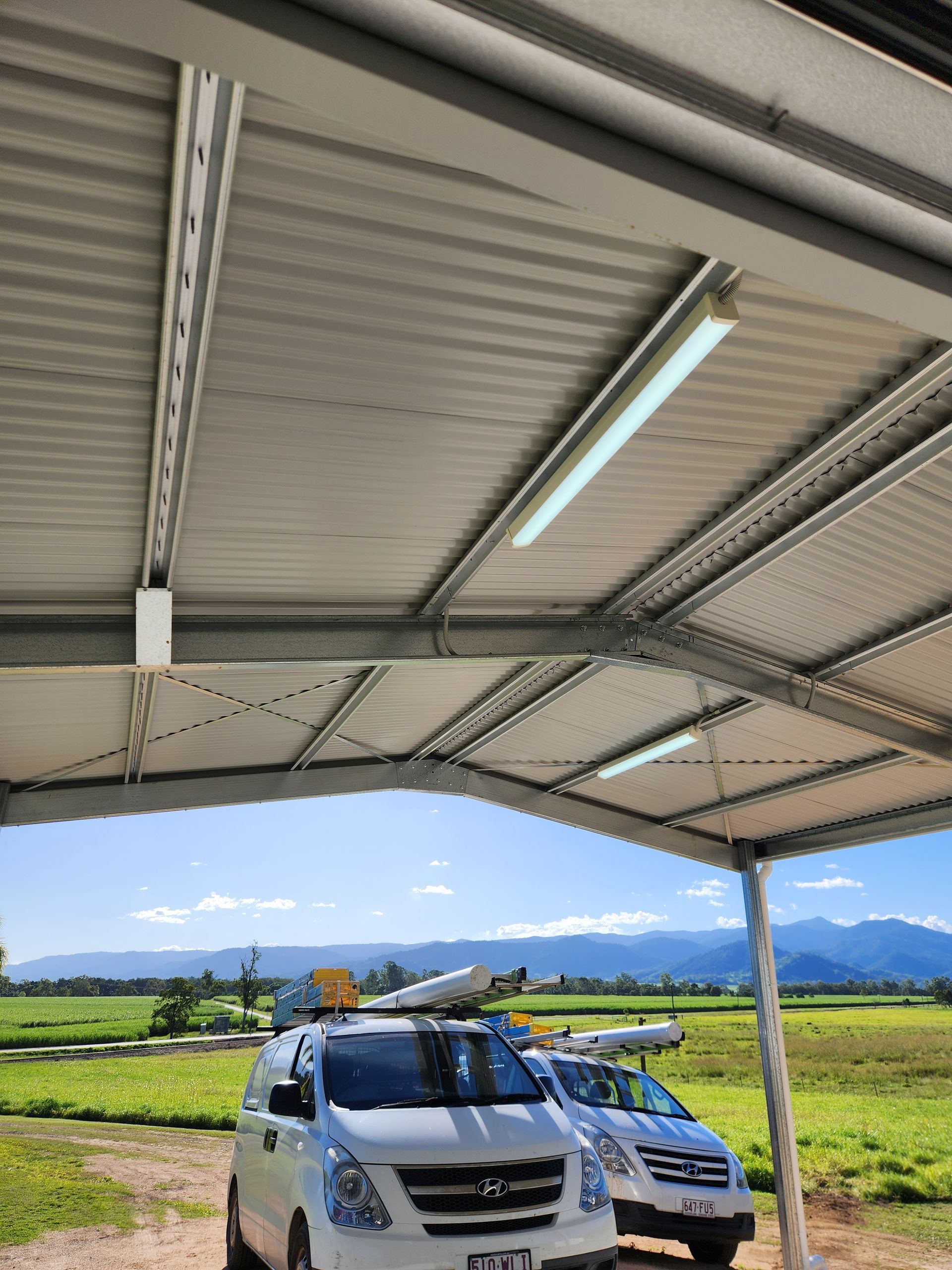 Two Utes In A Field — Prowire Services In Mackay, QLD