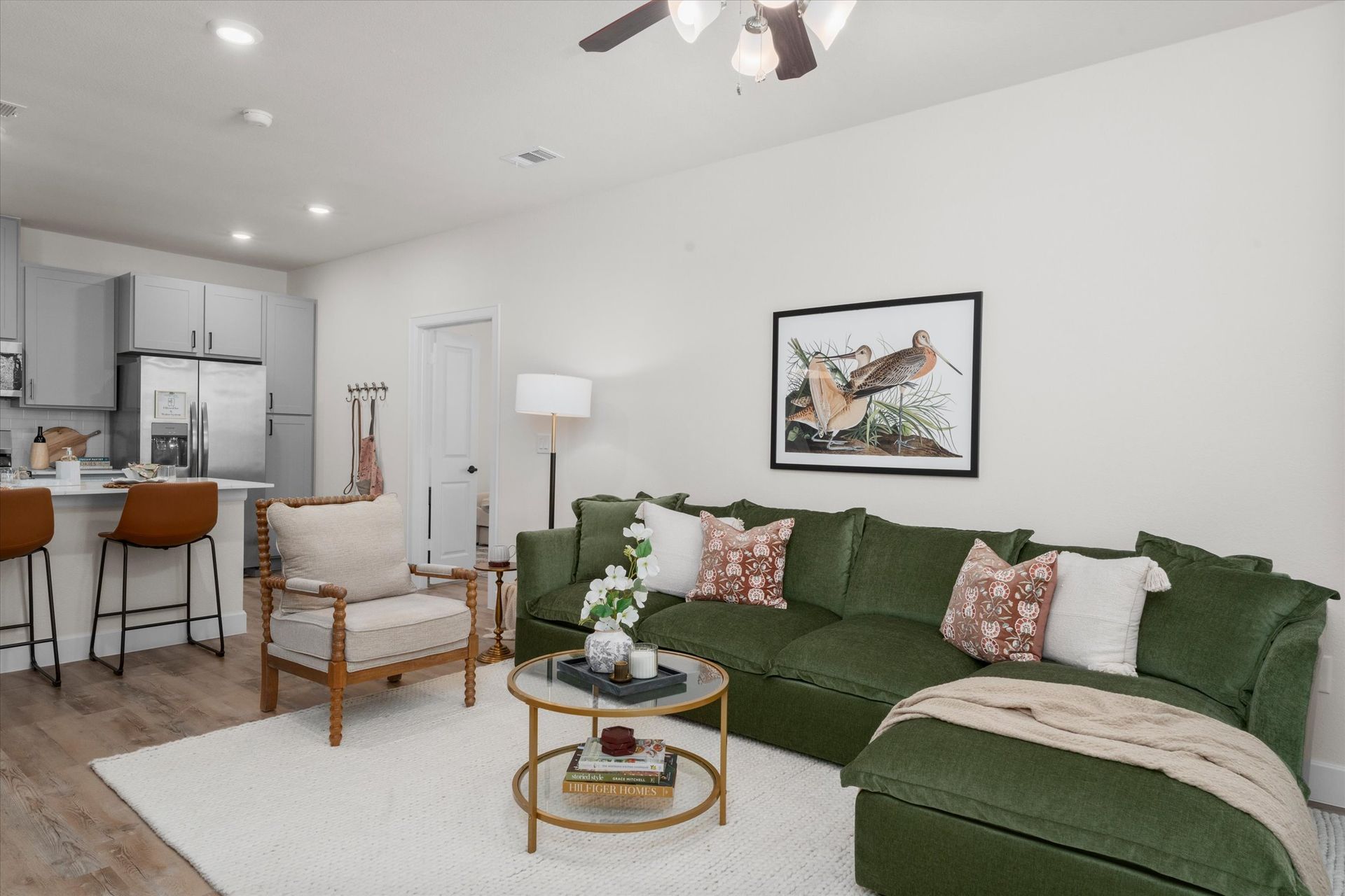 Modern cottage-style living room with open kitchen at Cottage Green Simpsonville