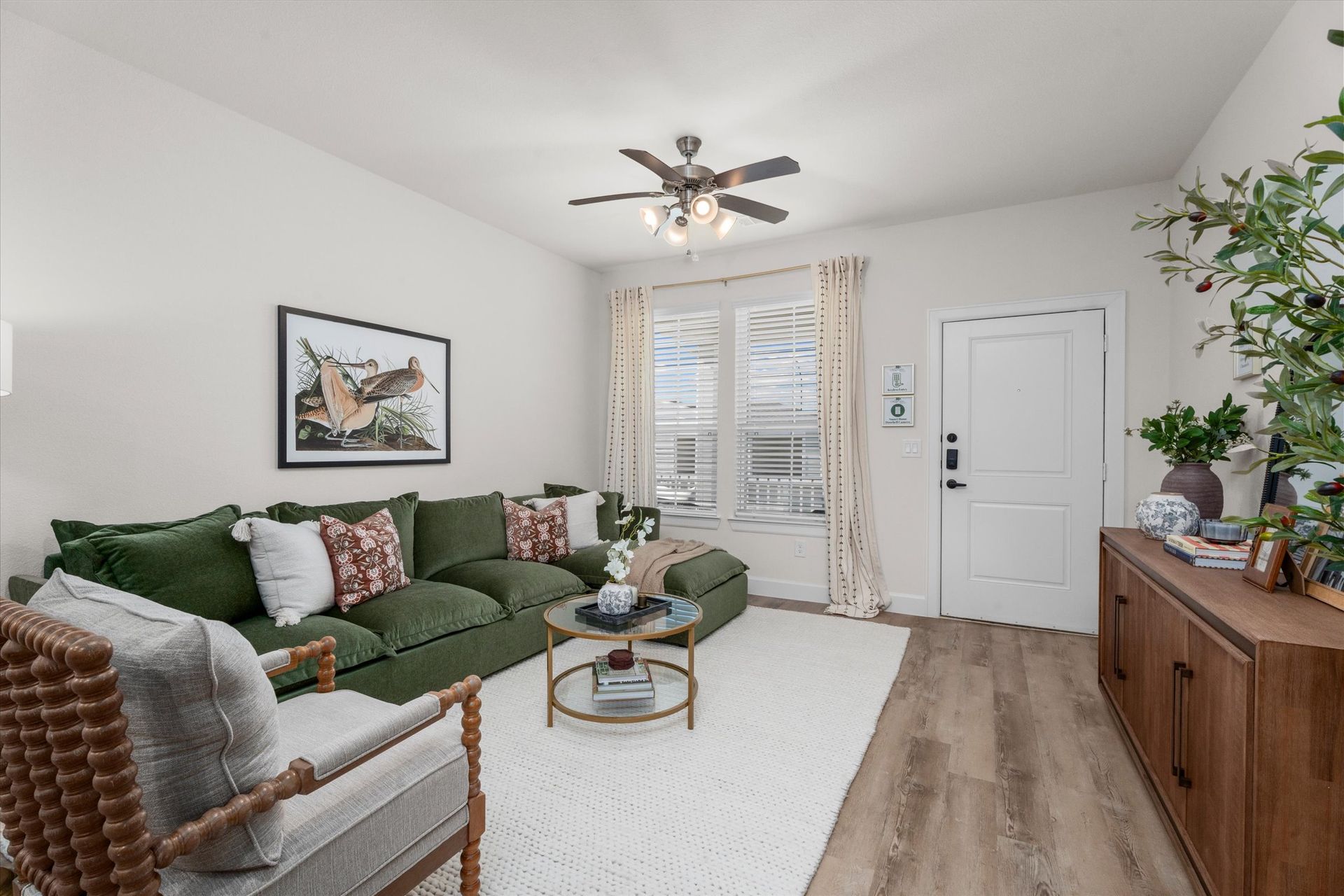 Cottage-style living room with private entrance and large windows at Cottage Green Simpsonville