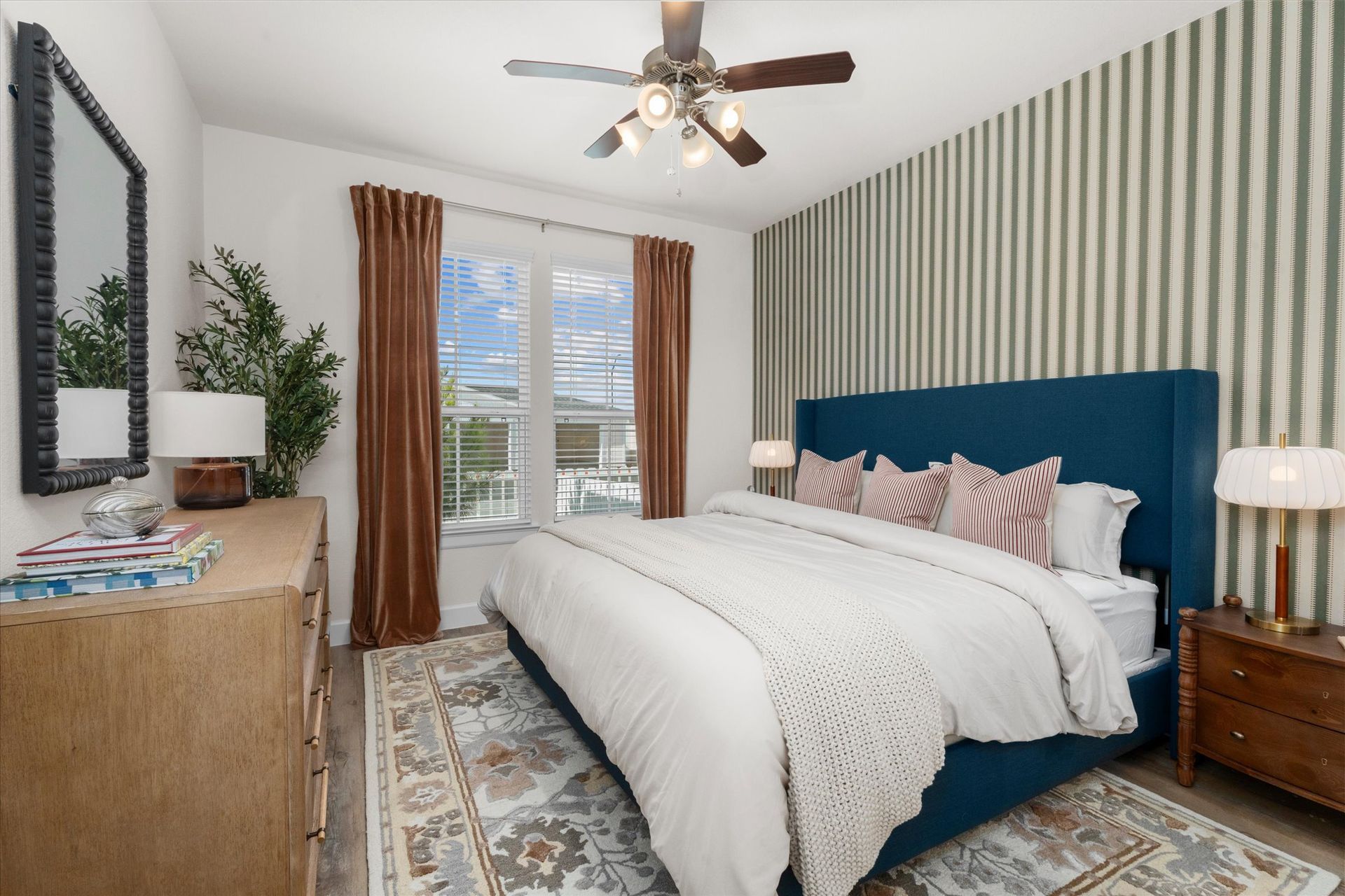 Spacious cottage-style bedroom with large windows at Cottage Green Simpsonville