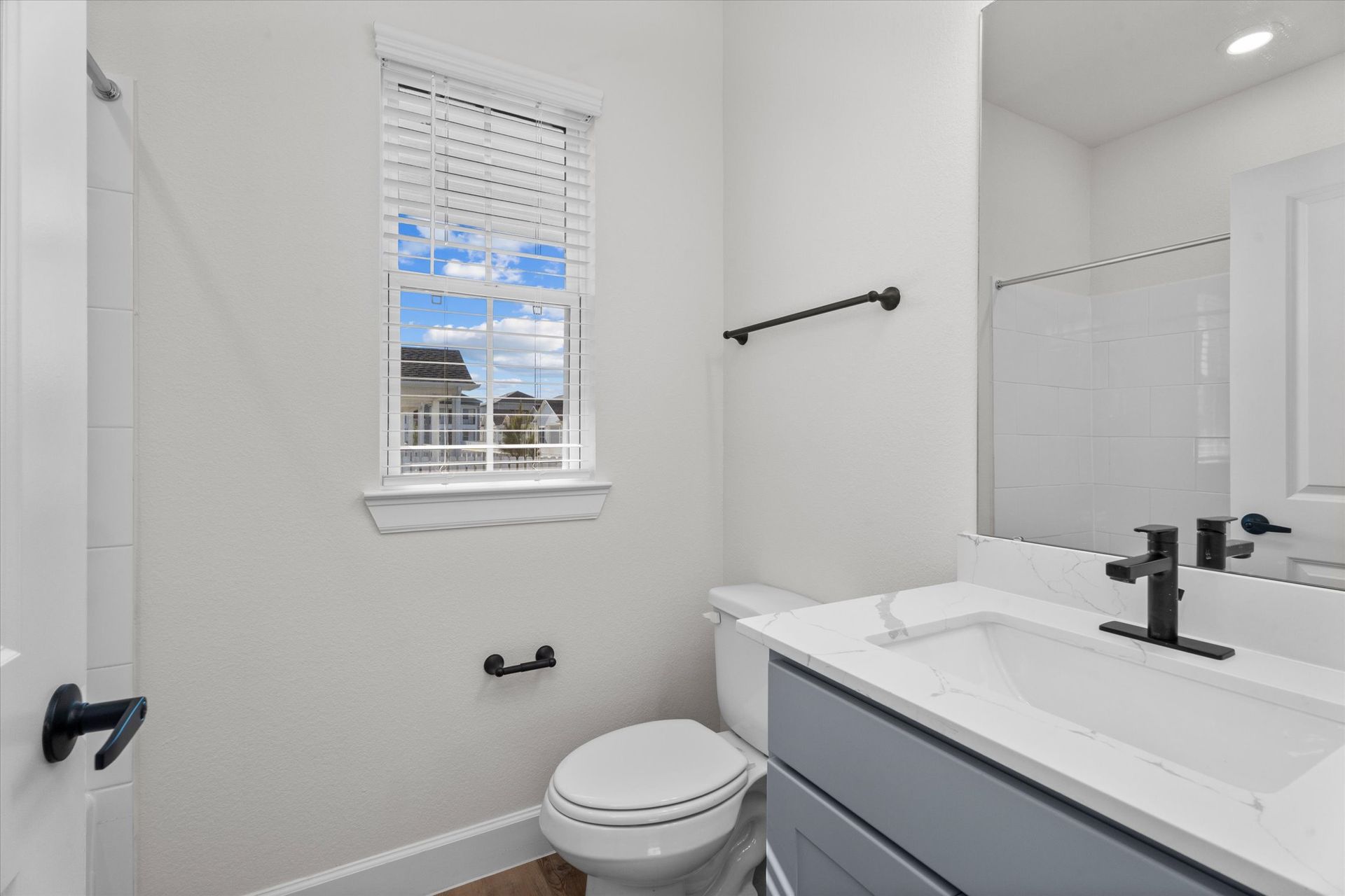 Modern apartment bathroom with vanity and contemporary finishes at Cottage Green Simpsonville