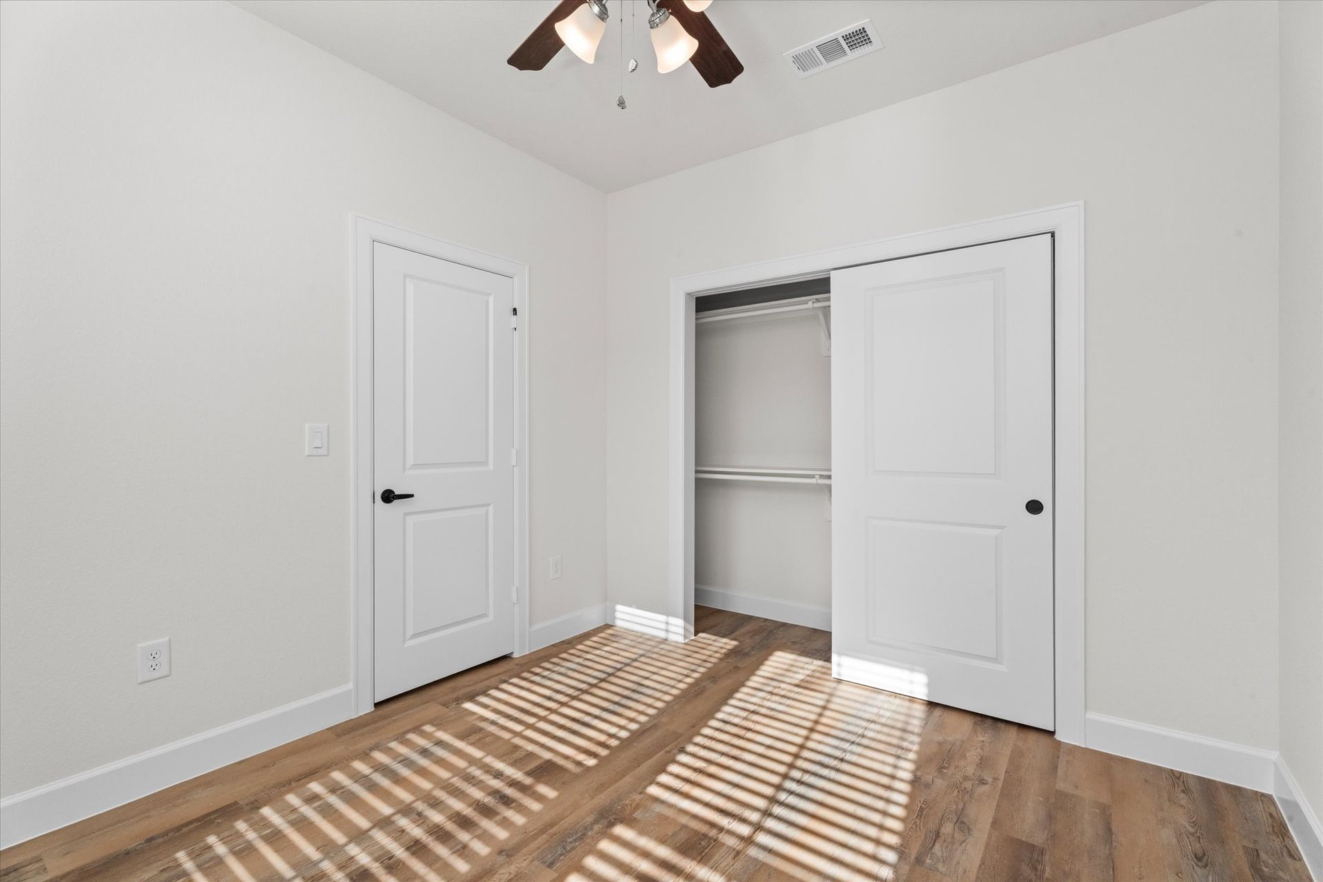 Apartment bedroom with walk-in closet at Cottage Green Simpsonville