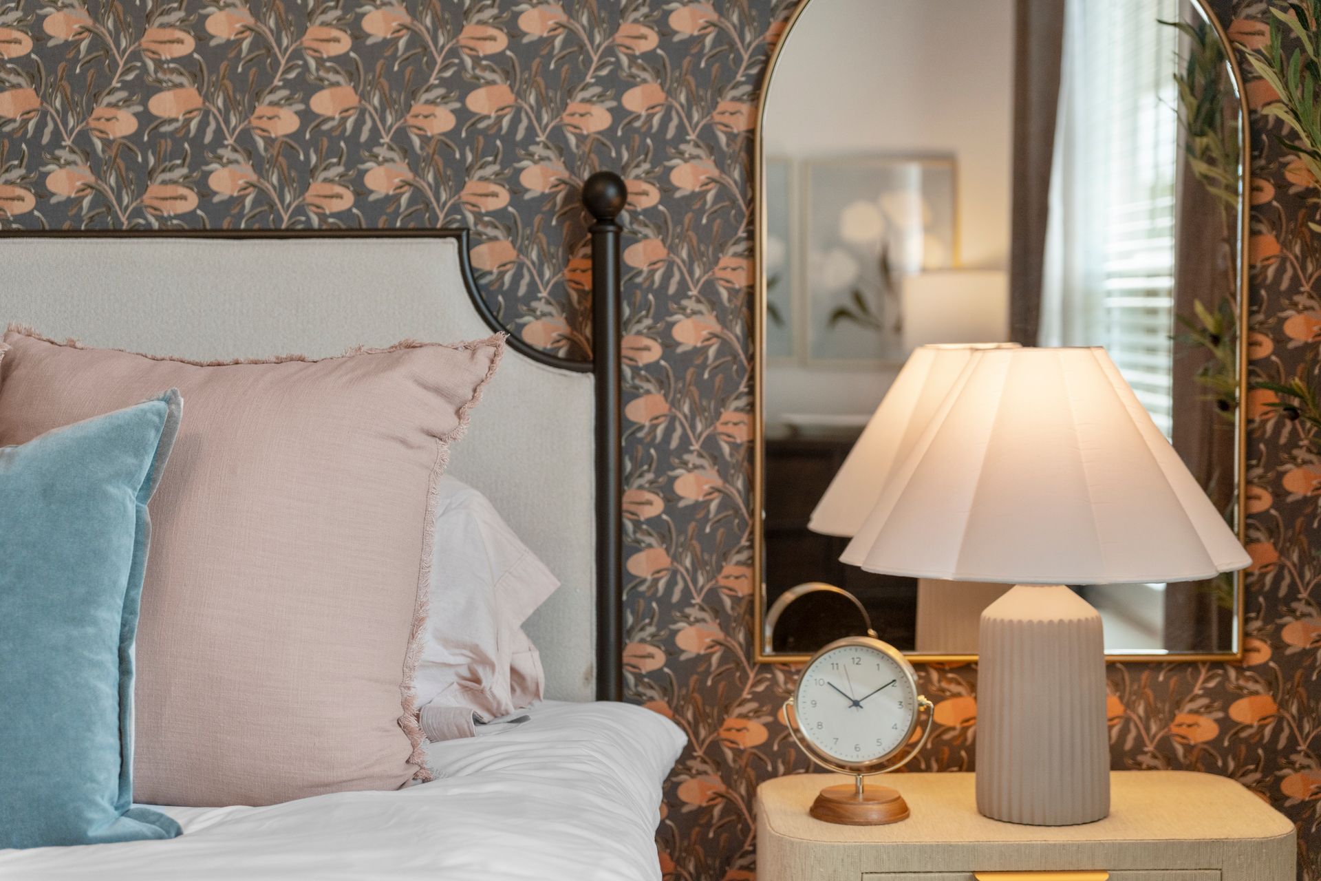 Cottage-style bedroom with decorative accent wall and modern finishes at Cottage Green Simpsonville
