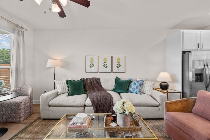 Open-concept kitchen and living area at The Cottage Green Simpsonville, offering new apartments near Greenville, SC.