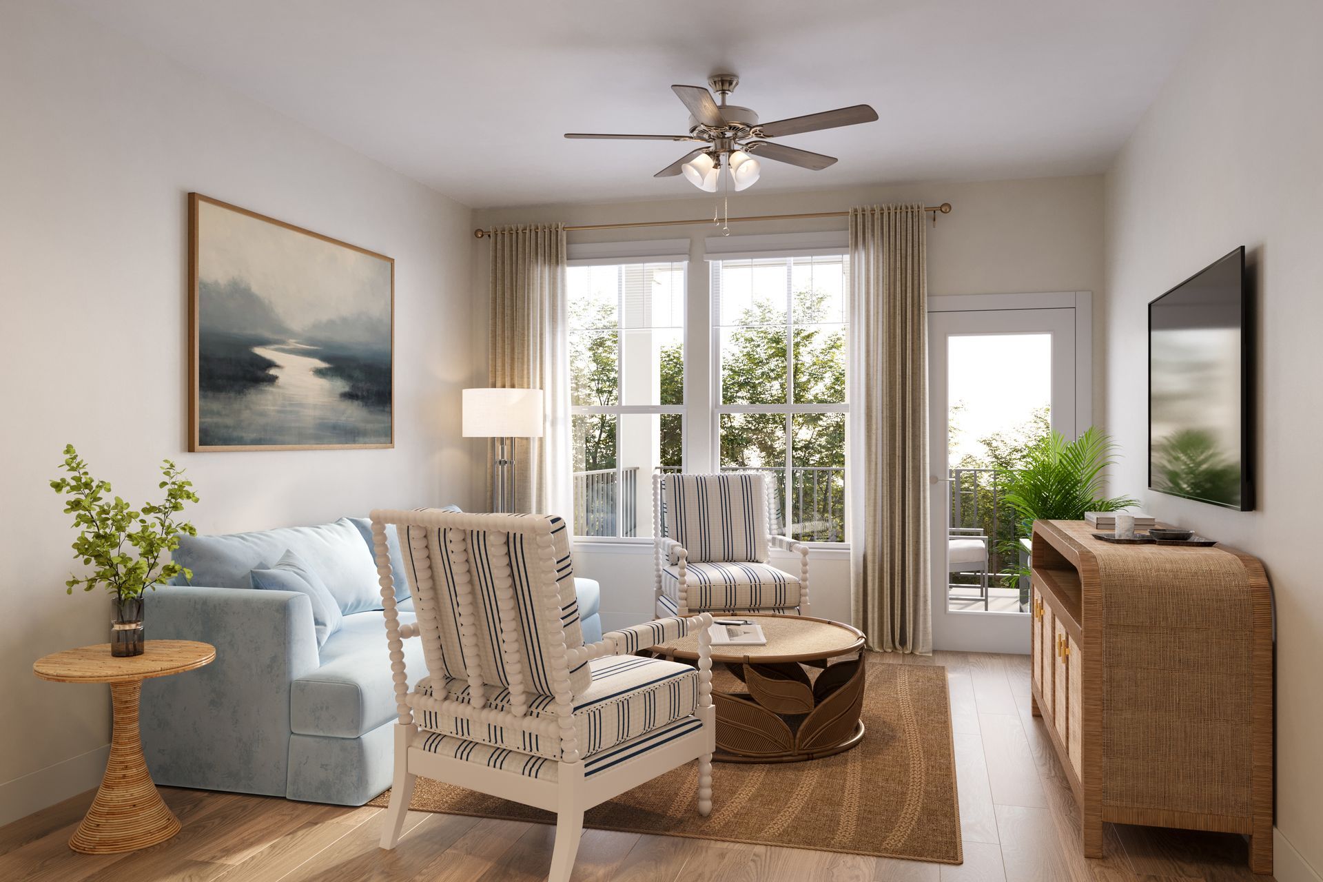 Bright living room with light blue sofa, patterned chairs, large windows, and wicker TV console.