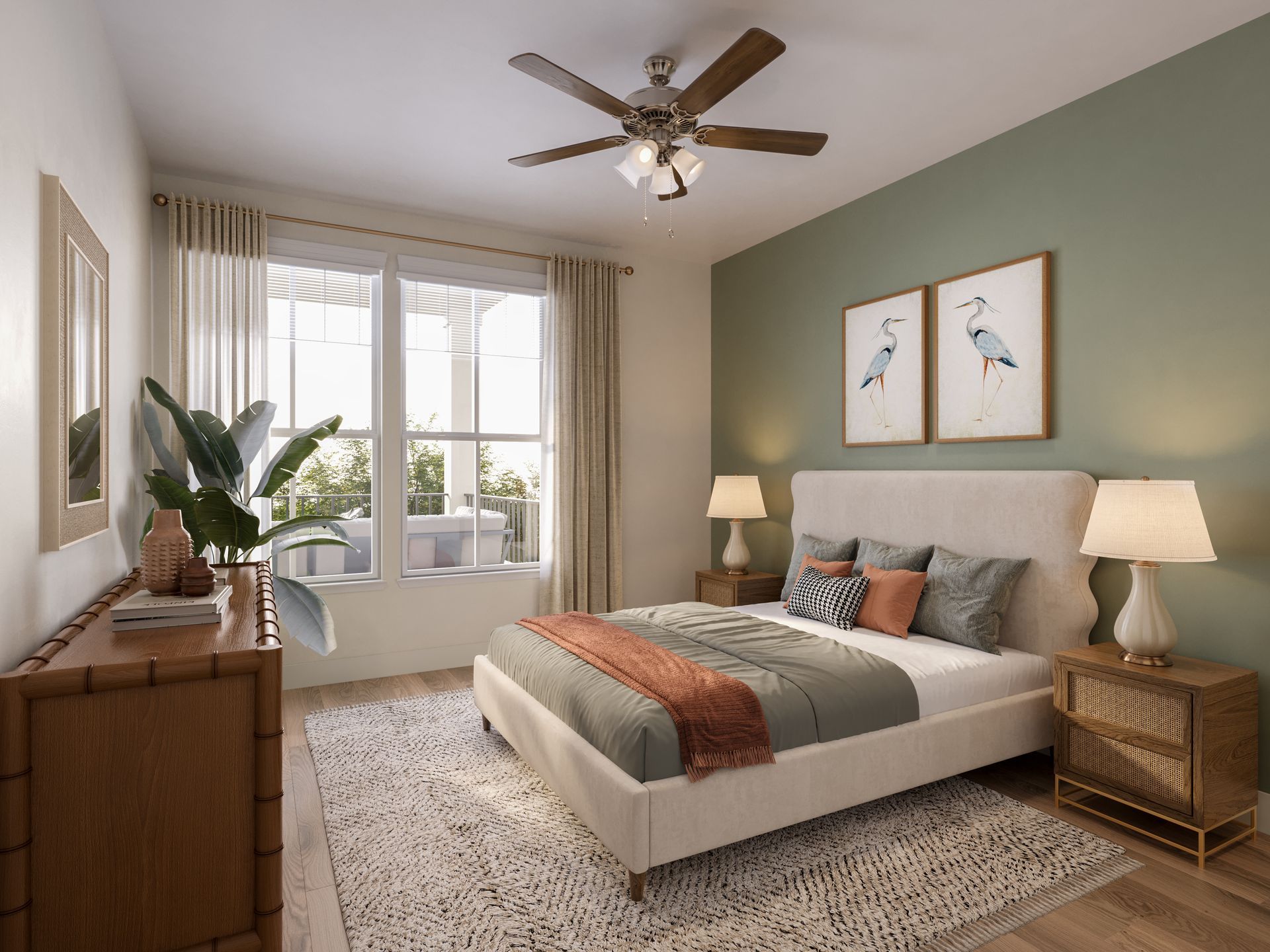 Bright bedroom with bed, nightstands, lamps, dresser, ceiling fan, and large window with curtains.