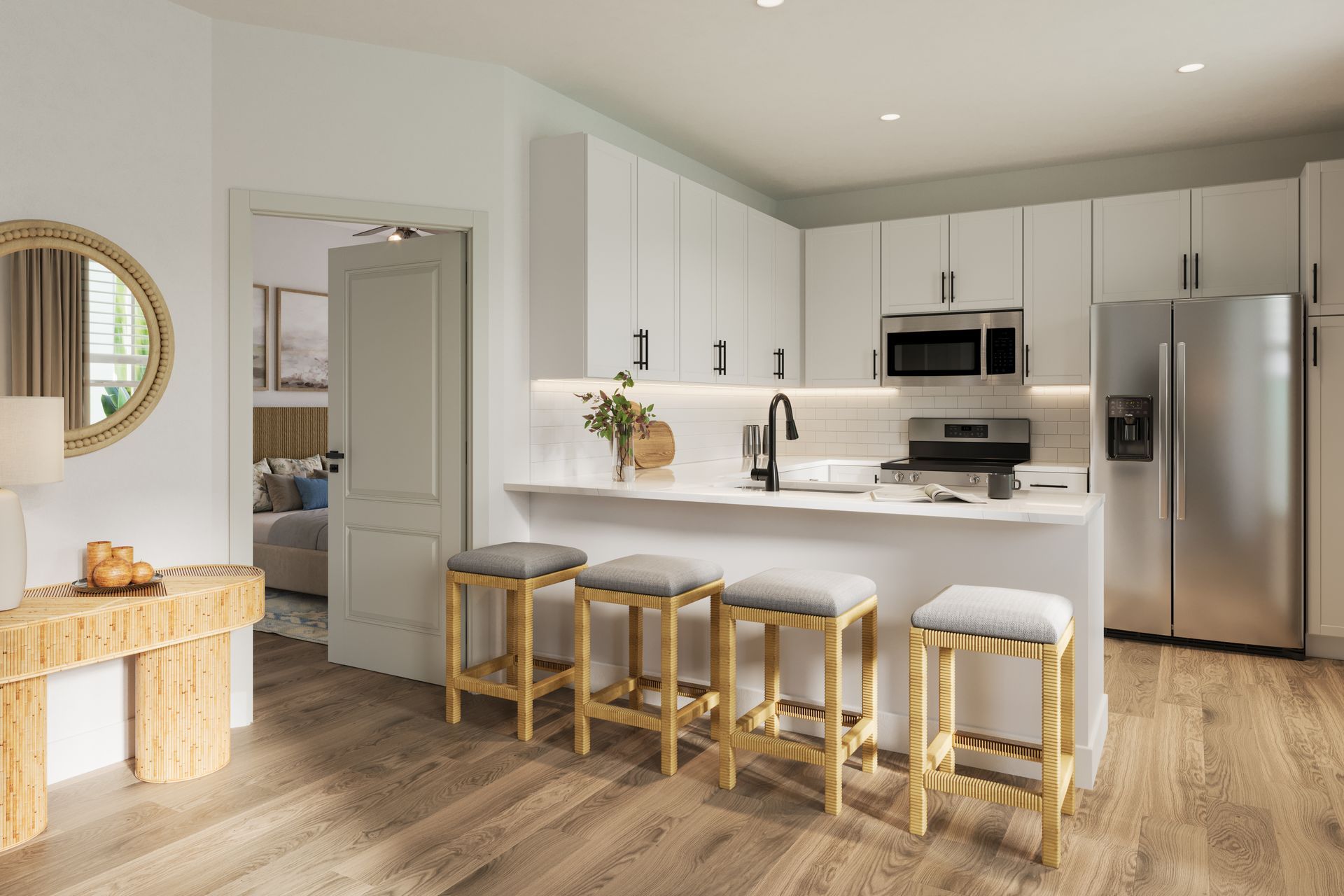Bright modern kitchen with white cabinets, island stools, stainless appliances, and light wood floors