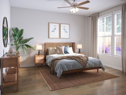 Bright bedroom with a bed, nightstands, woven rug, wood dresser, and large windows with white curtains