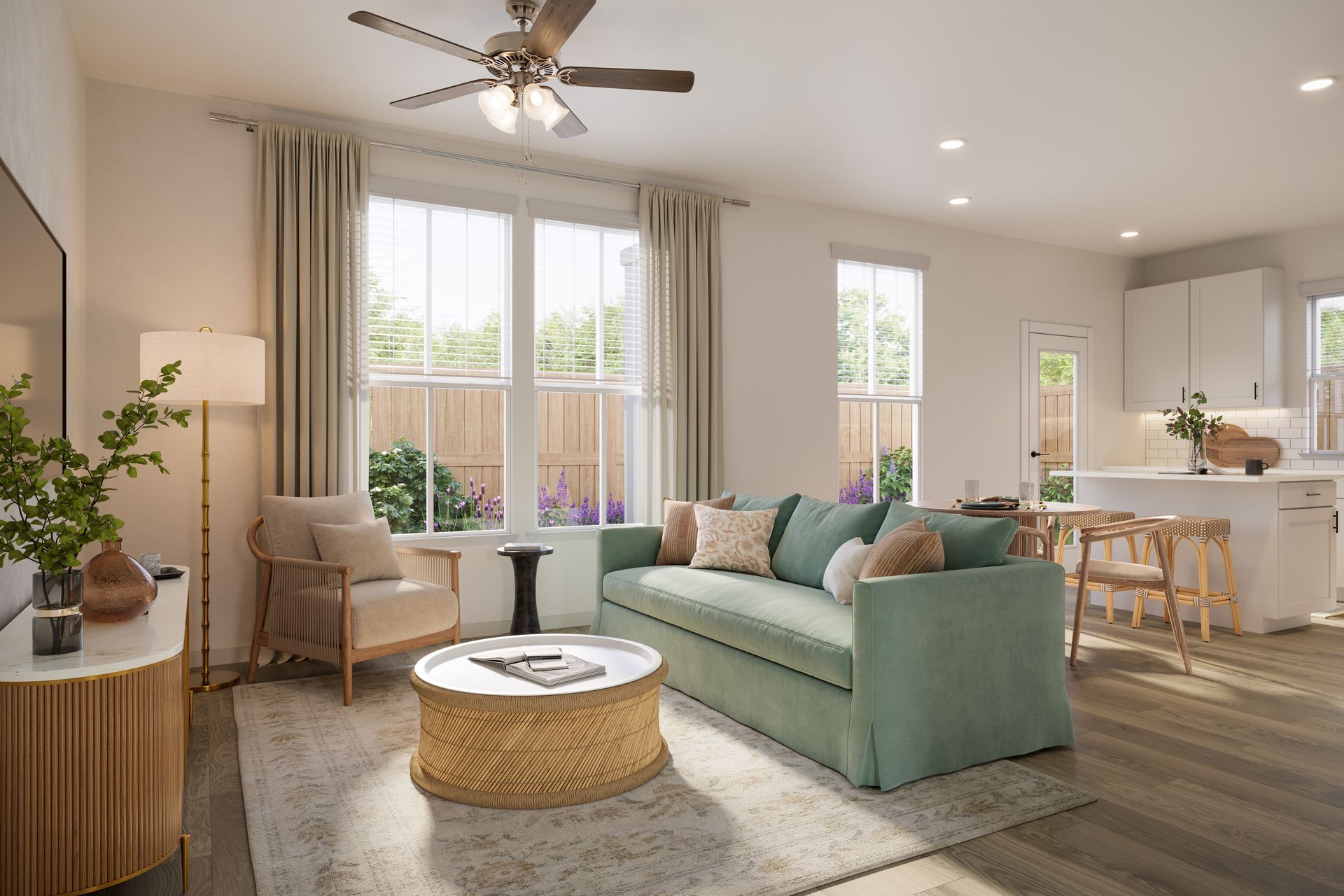 Bright living room with a mint sofa, woven coffee table, armchairs, large windows, and kitchen bar stools
