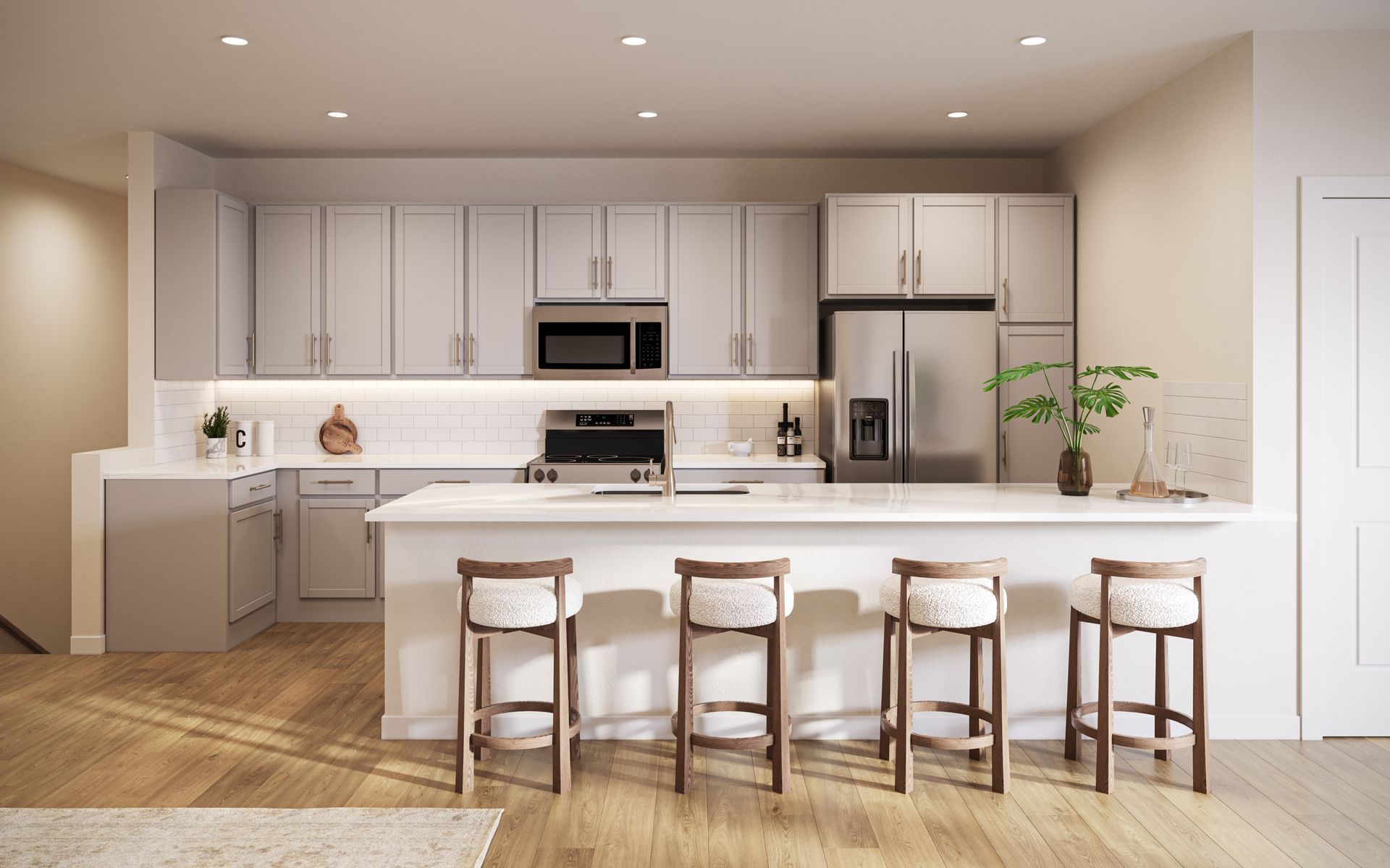 Bright modern kitchen with white cabinets, island, three stools, and stainless steel appliances