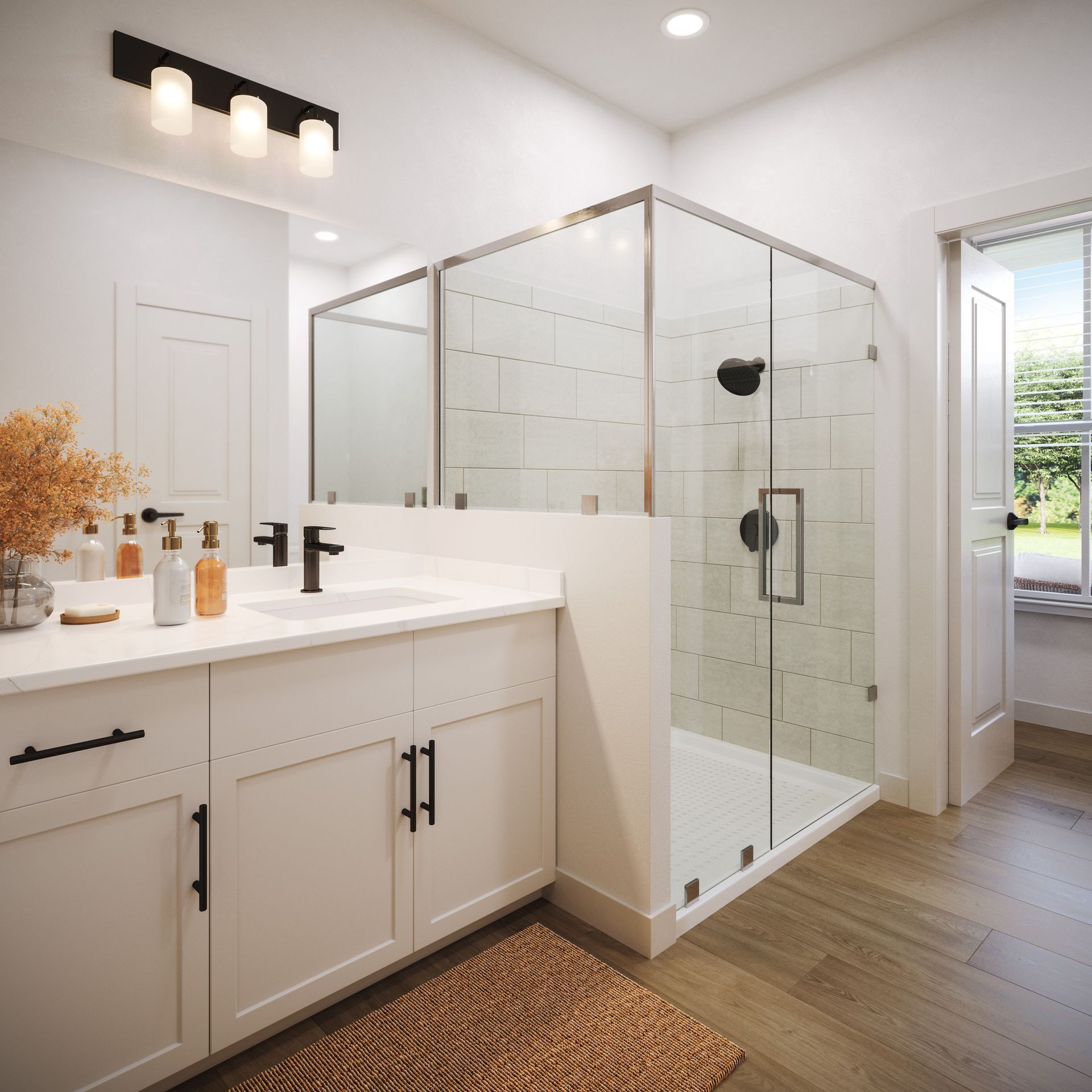 Bright modern bathroom with white vanity, glass-enclosed shower, and wood flooring