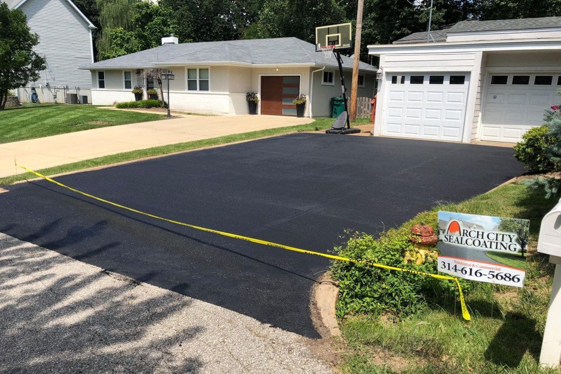 repairing an asphalt road in St. Louis MO