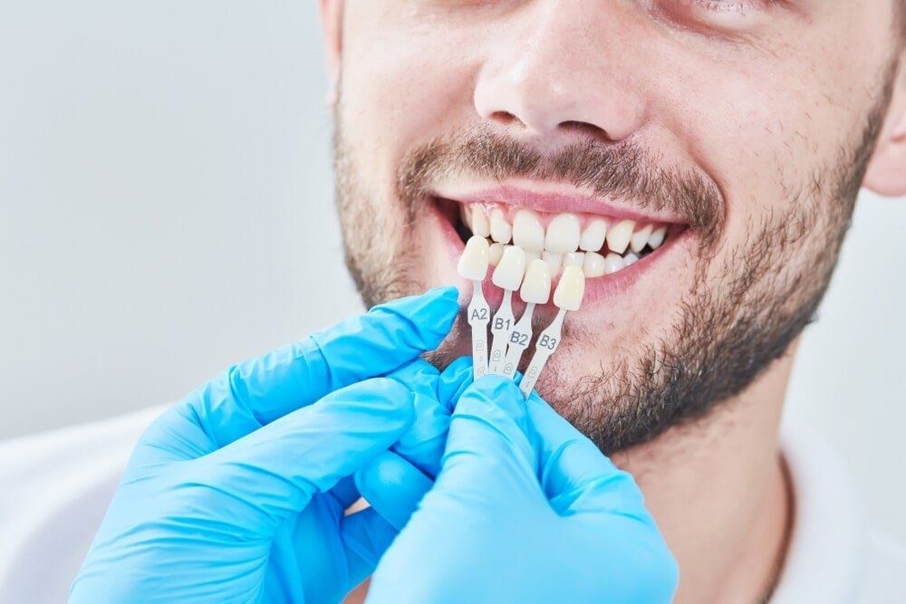 A Man is Getting His Teeth Examined by a Dentist — Bytes of Byron–Bio Holistic Dentistry in Byron Bay, NSW