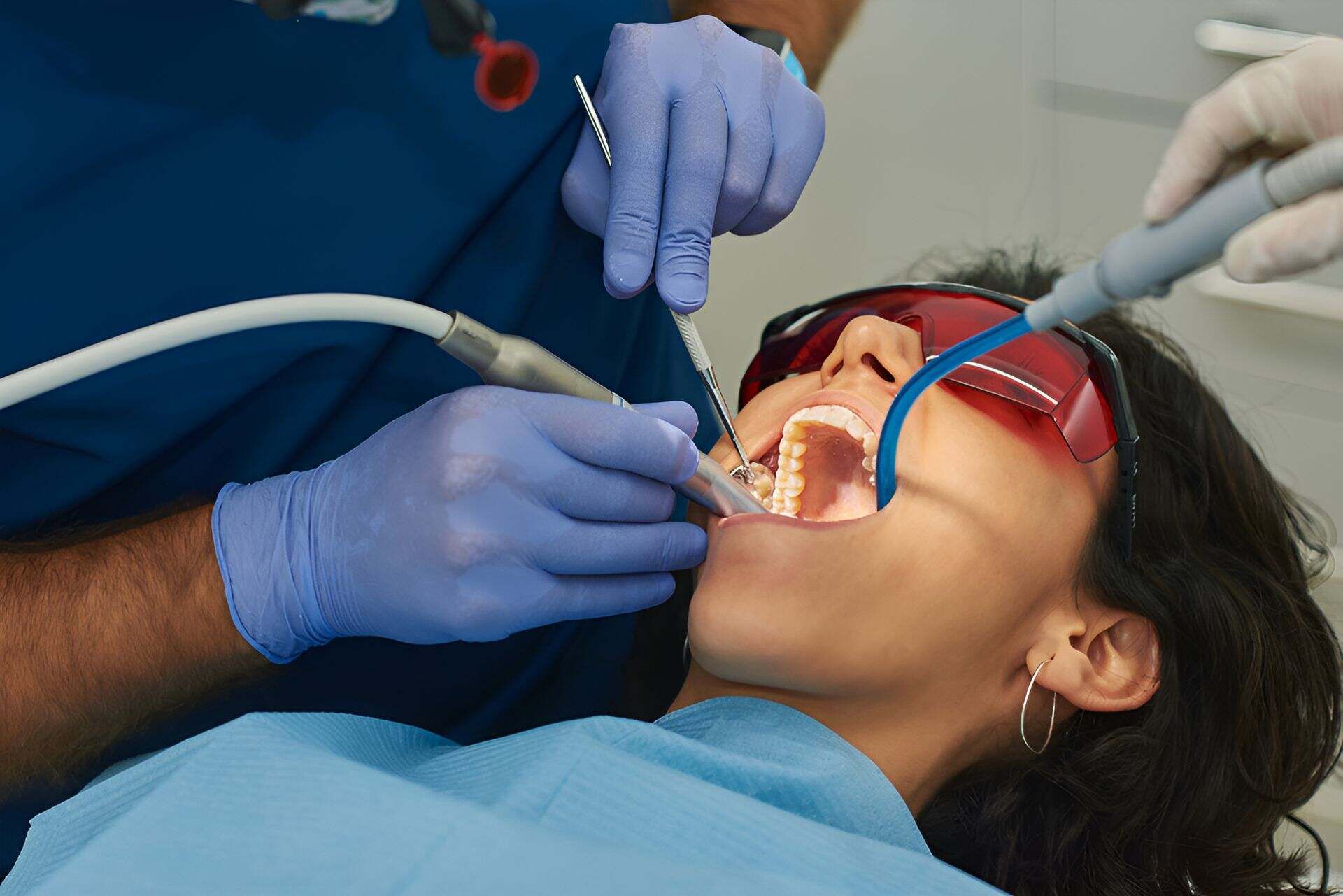A Woman is Getting Her Teeth Examined by a Dentist — Bytes of Byron–Bio Holistic Dentistry in Byron Bay, NSW