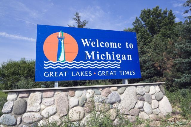 A welcome sign for Michigan featuring 'Welcome to Michigan: Great Lakes, Great Times.