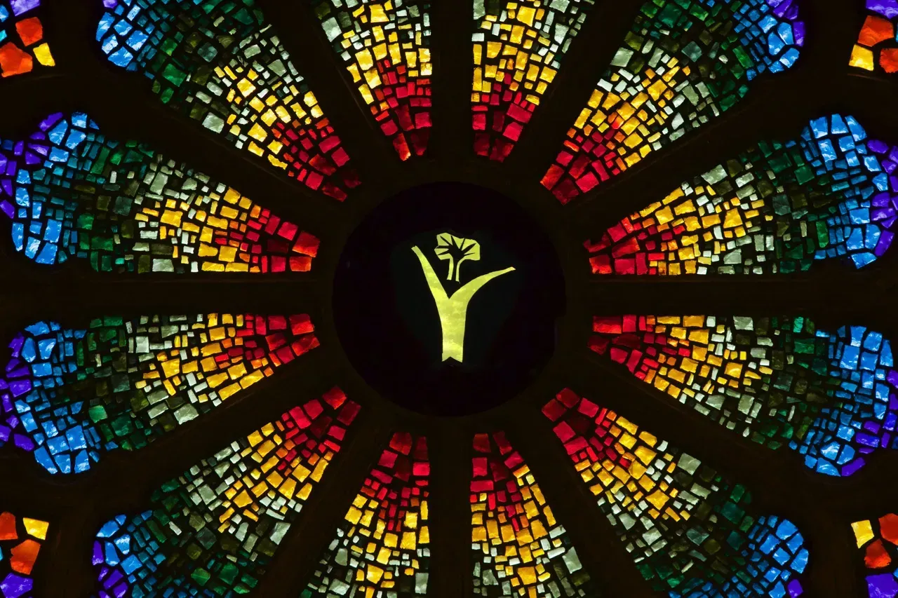 Rose Window with a yellow flower in the center.