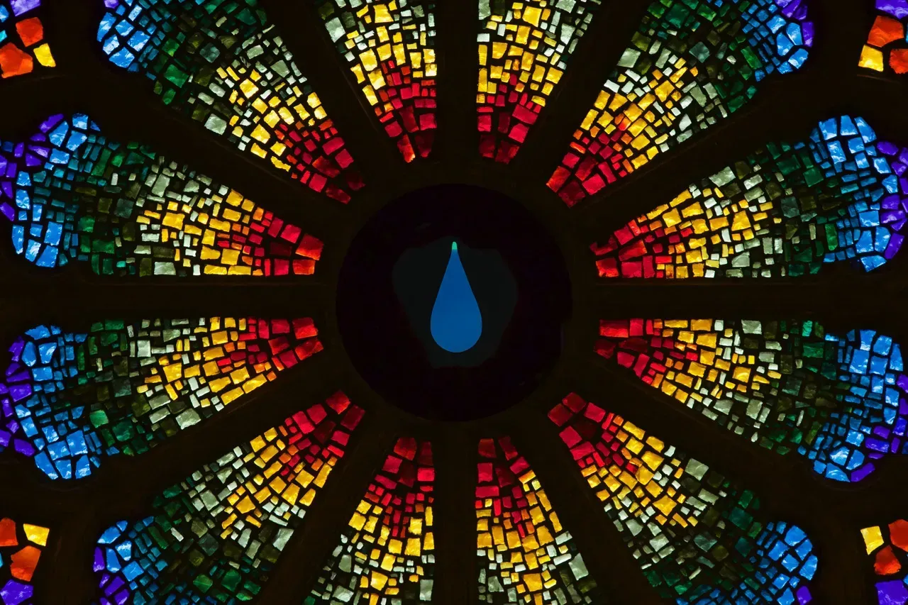 Rose Window with a blue tear drop in the center.