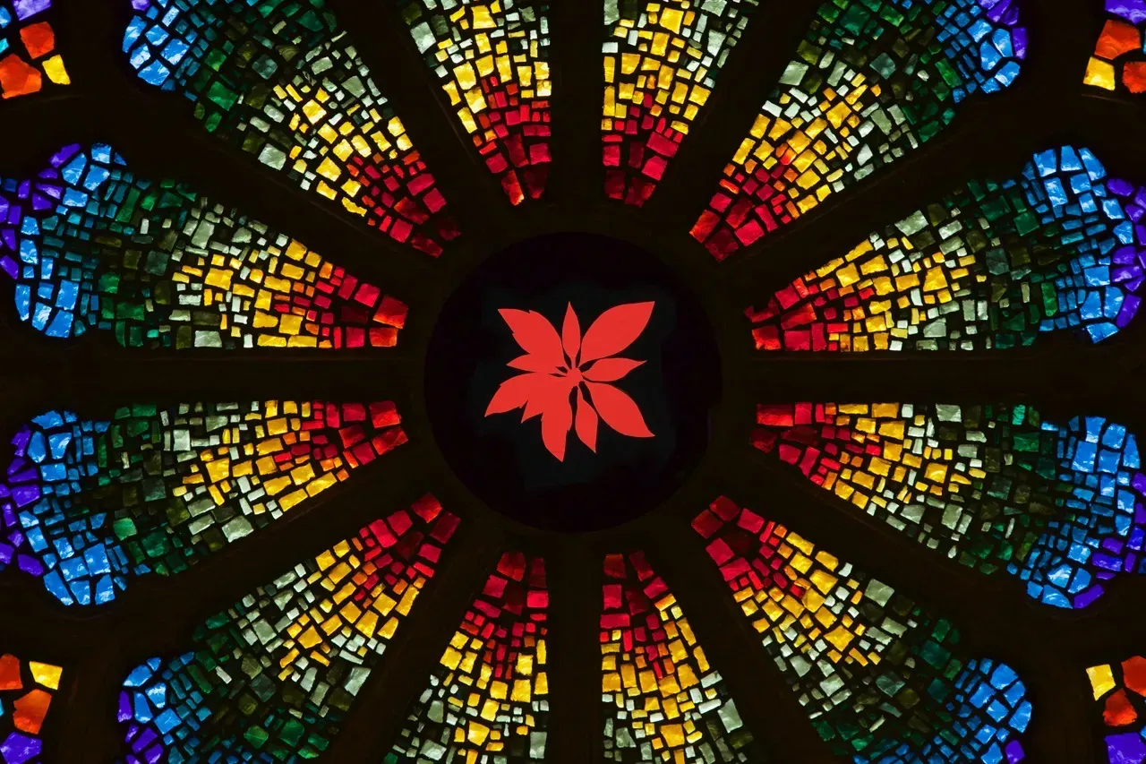Rose Window with a red Poinsettia in the center.
