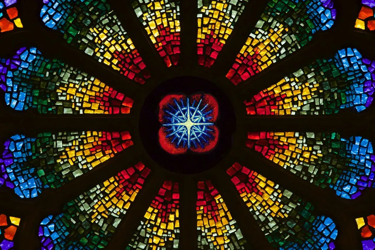 Rose Window with a splendid star suggesting a naturally occurring star of the night sky in the center.